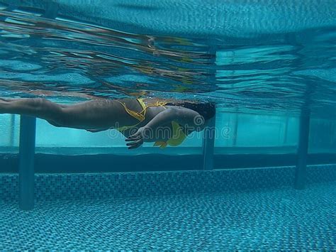 asian girl swim pass underwater photo shoot in pool stock image image of yellow beautiful