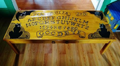Ouija board furniture if this furniture actually existed, you could get into the halloween spirit everyday with your very own ouija board carpet and coffee table. ouija board coffee table. the tableu002639s dimensions are ...