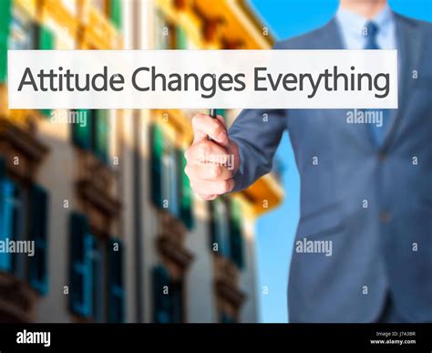 Attitude Changes Everything Businessman Hand Holding Sign Business