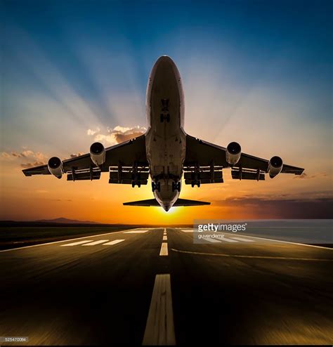 Stock Photo Passenger Airplane Taking Off At Sunset Airplane