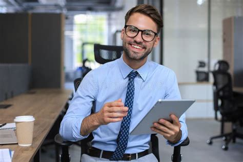 Young Businessman Using His Tablet In The Office Stock Image Image Of