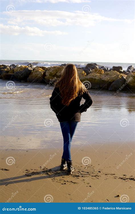 Concept Of Loneliness And Sadness Woman In Front Of Ocean Stock Image
