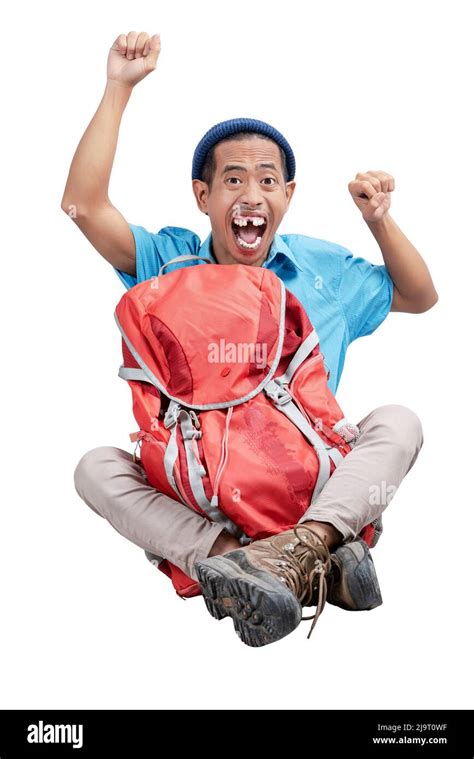 Asian Man With A Beanie Hat Sitting With His A Backpack Isolated Over