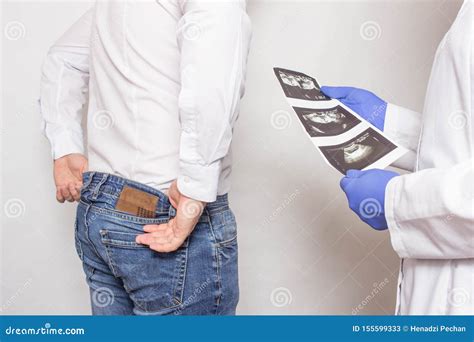 Doctor Urologist Holds A Picture Of An Ultrasound Examination Of The Patient`s Prostate Gland