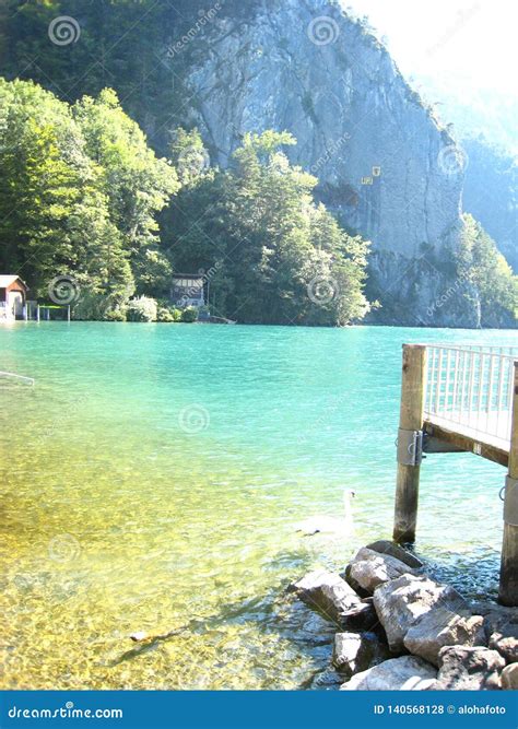 Beautifully View With A Landing Stage And A Turquoise Blue Swiss Lake