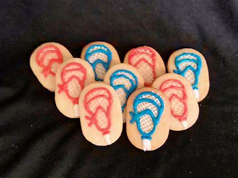These cute cookie sticks are a fun twist on cookies! Lacrosse stick sugar cookies w/ royal icing
