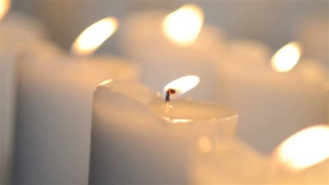 Close Shot Of A White Candle Burning With Bright Candle Light Few