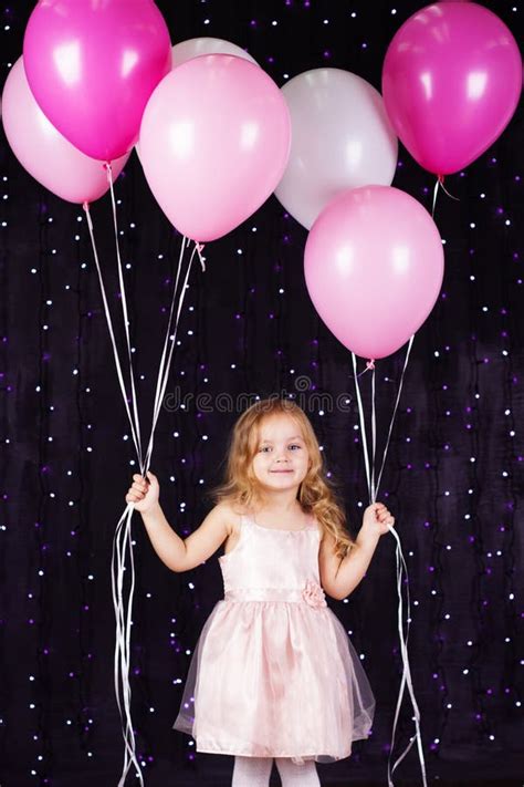 Little Girl With Balloons And T Boxes In Studio Stock Image Image