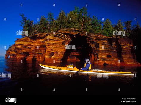 A Sea Kayaker On Lake Superior At The Sea Caves On Devils Island In