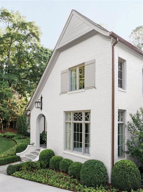 Discover The Charm Of A White Brick House With White Shutters See