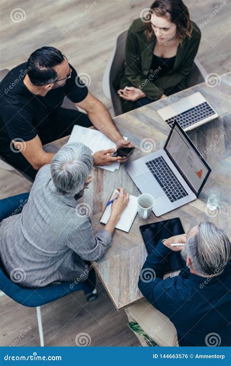 Business People Discussing New Plan In A Meeting Stock Photo Image Of