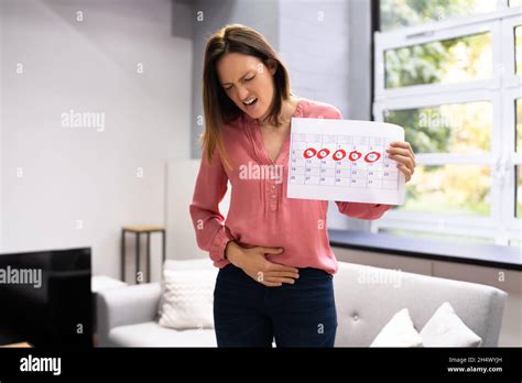 Woman Menstruation And Pms Period Pain Stomach Ache Stock Photo Alamy