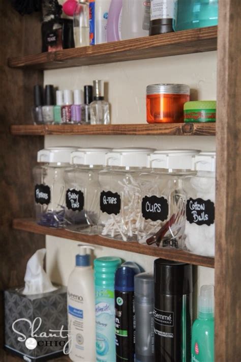 Next install also the industrial shelves to your bathroom wall by making use of recycled wood and plumbing scrap and also make the tiered bathroom. DIY Bathroom Storage Cabinet | Hometalk