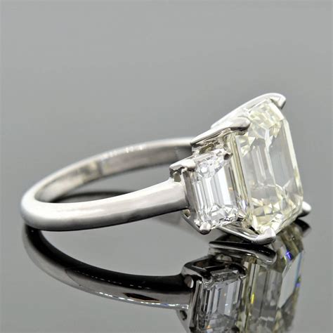 Contemporary 413 Carat Emerald Cut Diamond Platinum 3 Stone Engagement