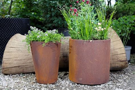 Round Corten Steel Planters Features London Stone