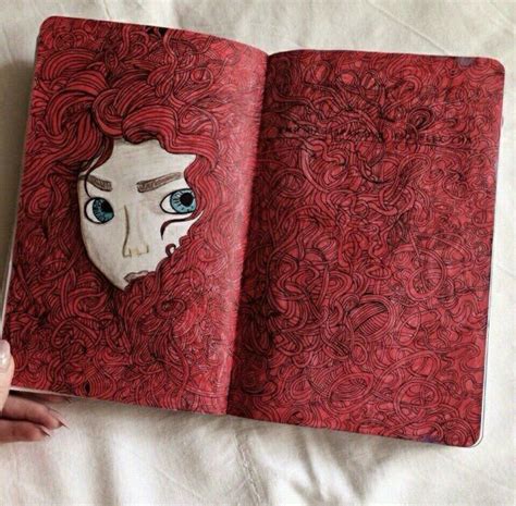 An Open Book With A Drawing Of A Woman S Face In The Middle And Blue Eyes