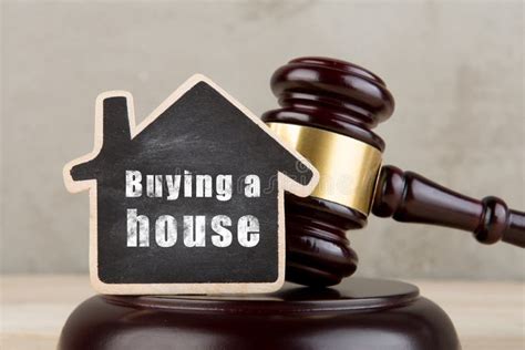 Real Estate Concept Auction Gavel And Little House With Inscription