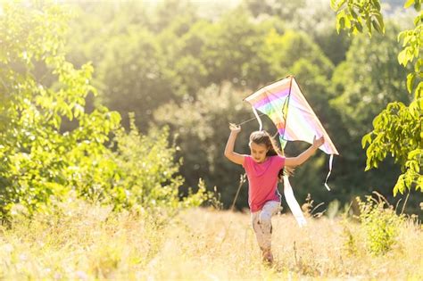 Premium Photo Little Girl Running Outdoor With A Kite