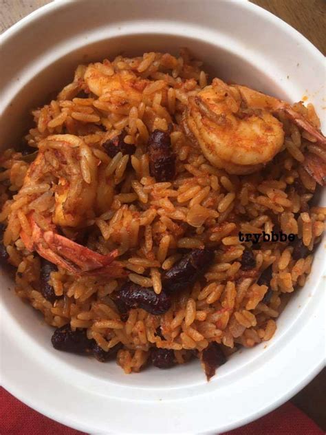 The rice steam on low heat for 10 minutes. Jollof Rice And Beans | Rice and beans recipe, African ...