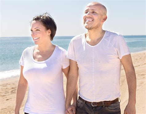 Man And A Middle Aged Woman Sitting On The Beach Stock Image Image Of Ethnicity Activity