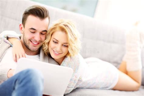 Romantic Couple With Laptop In Living Room Stock Photo Image Of Space
