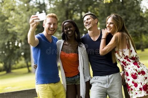 Young Multiracial Friends Taking Selfie In The Park Stock Image Image