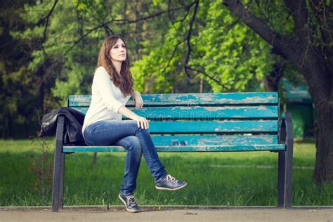 Young Beautiful Woman Sitting On Bench In Park Stock Photo Image Of