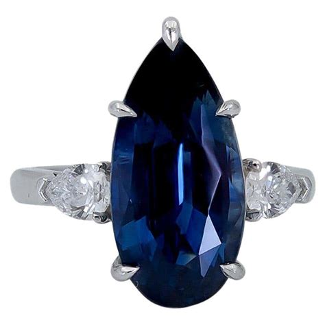 973 Carat Pear Shape Blue Sapphire And Diamond Three Stone Engagement