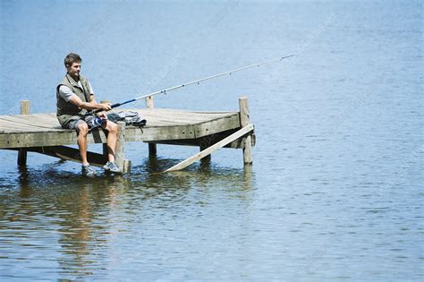 Man Fishing From Dock Over Lake Stock Image F0308140 Science