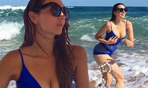 Ricki Lee Coulter Showcases Her Sexy Curves In A Plunging Swimsuit