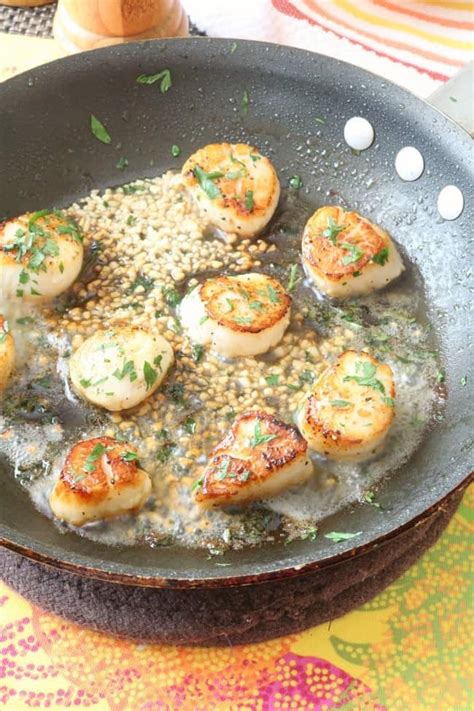 I love a good hard sear on a sea scallop, a little crust, and a splash of wine in the butter at the end to provide a silky acidity against the sweet of the meat. Pan-Seared Scallops