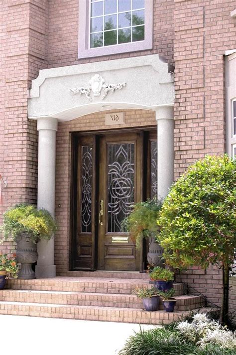 It's good to put a little thought into the color you'd like to paint the exterior trim of your home when dark red and brown bricks form one of the primary architectural details. Pink brick house photos