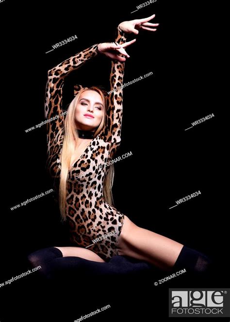 Blonde Female Dressed In Cat Girl Suit Woman In Fancy Masquerade Costume Of Leopard Stock