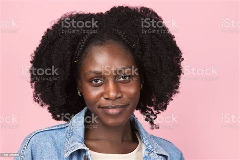 Africanamerican Woman Portrait Isolated On Pink Studio Background With