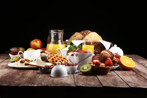 Huge Healthy Breakfast On Table With Coffee Orange Juice Fruits