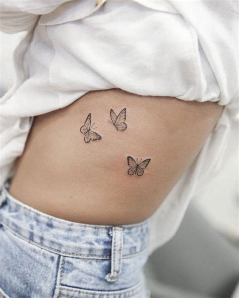 Fine Line Butterflies Tattoo On The Rib