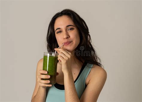 Happy Beautiful Fit Sport Woman Smiling And Drinking Healthy Fresh Vegetable Detox Smoothie