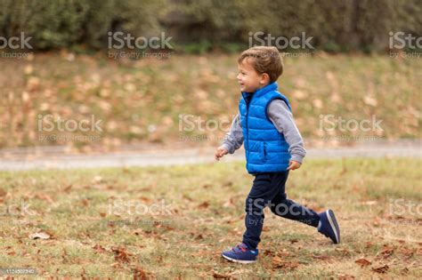 Cute Boy Running Stock Photo Download Image Now Autumn Beauty