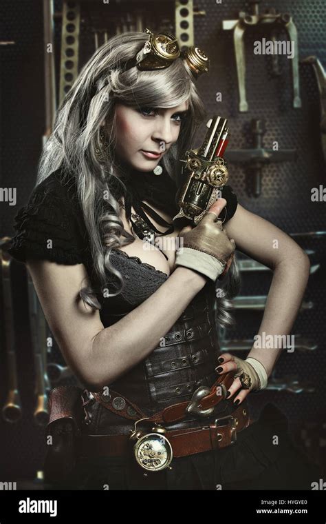 Portrait Of Steampunk Woman With Gun Mechanical Background Stock Photo Alamy