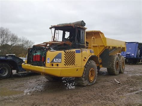 Dumper Truck Being Winched Onto Low Loader