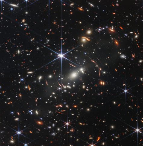 A Galaxy Cluster As It Appeared 46 Billion Years Ago •