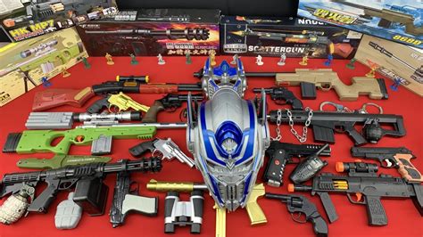 Many Toy Weapons And Boxes Sniper And Assault Rifles Voiced Optimus
