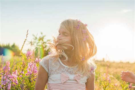 Download Cute Girl With Pink Flowers Wallpaper