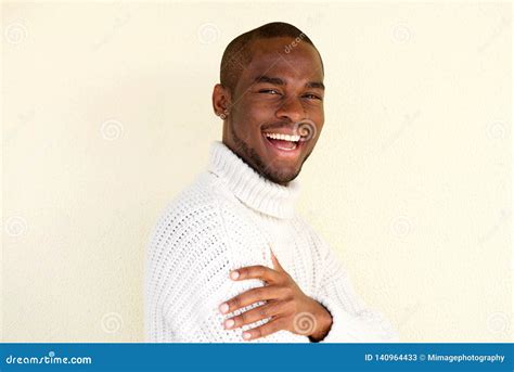 Side Portrait Of Attractive African American Man In Sweater Smiling