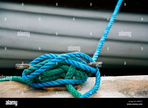 Boat Tied Up To Dock With Nylon Rope Around Cleat Stock Photo Alamy