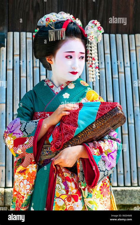 Young Beautiful Japanese Women Called Maiko Wear A Traditional Dress