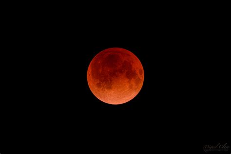 Total Lunar Eclipse With A Super Red Moon Immersed In A Colorful