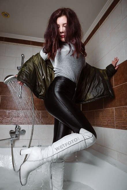 wetlook by beautiful girl in fully wet disco pants jacket and boots