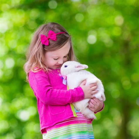 Little Girl Playing With Rabbit Stock Photo Image Of Care Adorable