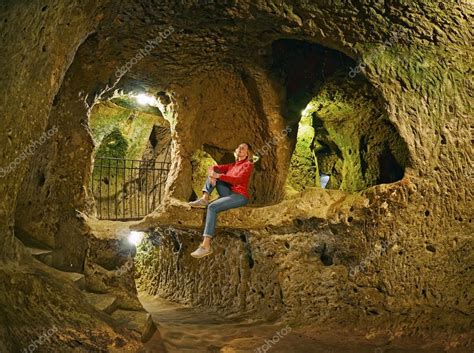 Young Woman Sitting On The Rock Derinkuyu Cave Underground City
